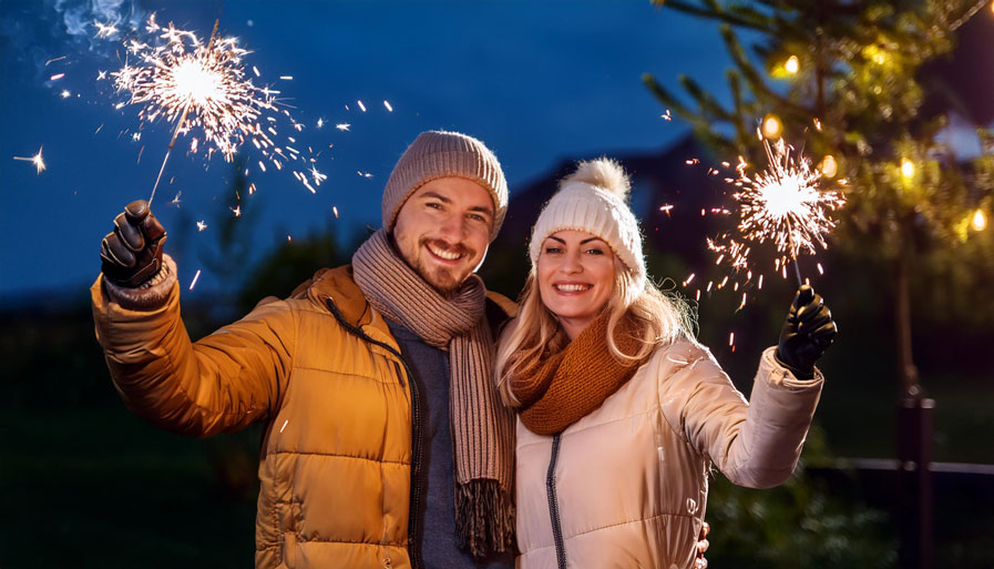 Couple Holding Sparklers on Bonfire Night